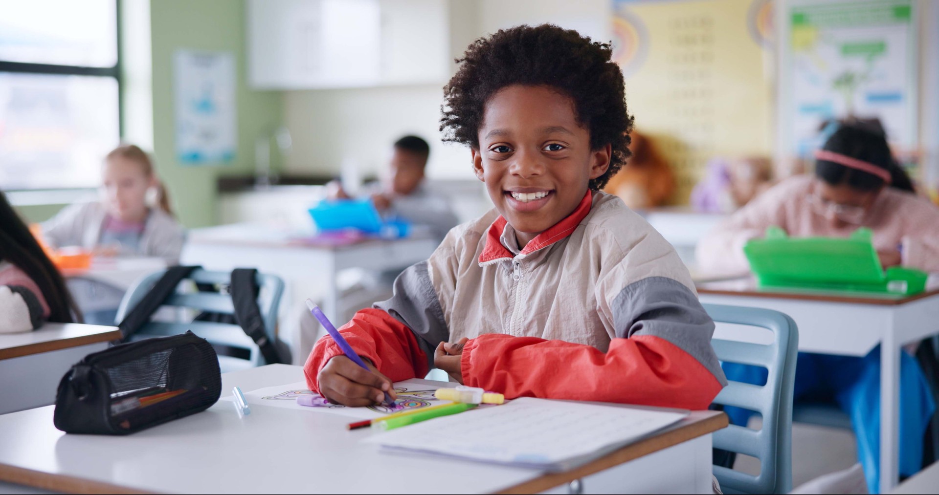Students, portrait and boy with education, writing and knowledge with book, creativity and drawing. Kids, school and smart with intelligent, learning and exam with assignment, project and children